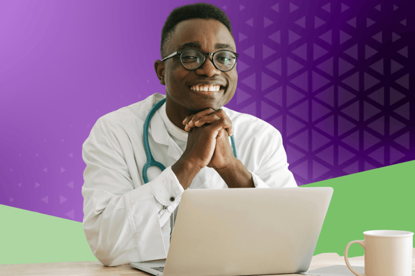 Smiling doctor using laptop for medical billing and revenue cycle management, symbolizing confidence in secure, integrated practice management solutions.