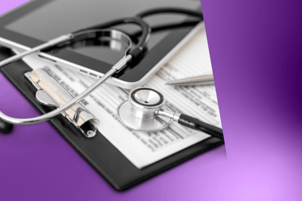 Stethoscope and tablet on medical billing forms, illustrating digital revenue cycle management and HIPAA‑compliant billing software.