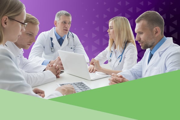 doctors sitting around a desk