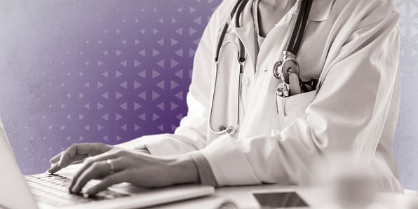 Doctor at a desk with a laptop